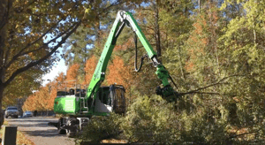 The SENNEBOGEN 718 tree machine sets up quicker than a crane with its self-leveling outriggers.